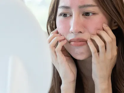Stock photograph of a model: a woman with flushed, red cheeks touching her face while looking into a round mirror