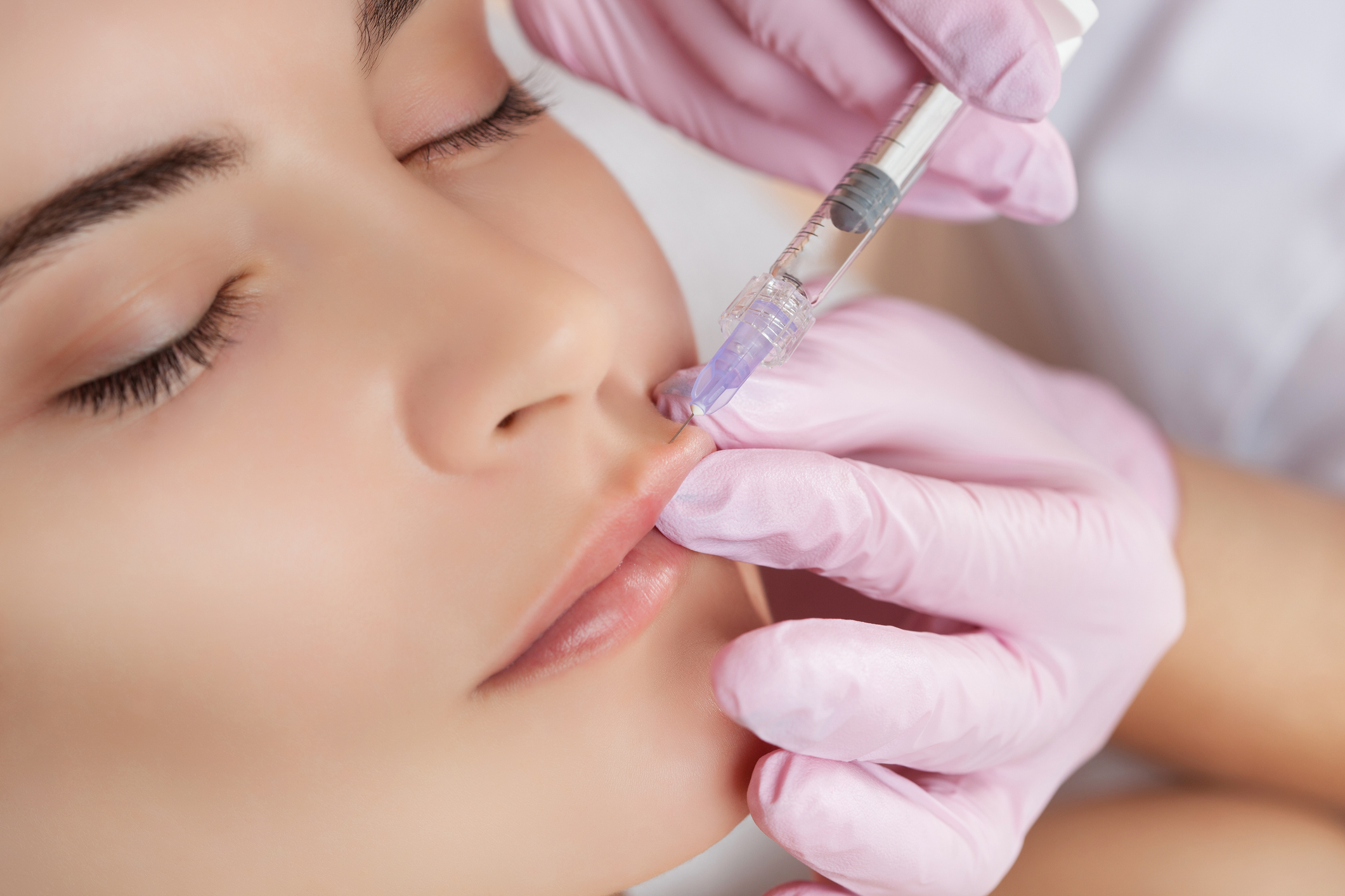 Stock image of a woman receiving a cosmetic injectable treatment