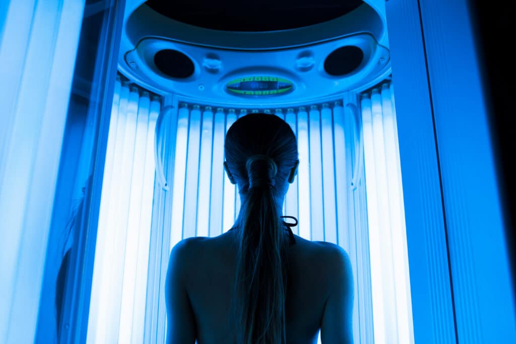 Woman approaching tanning bed
