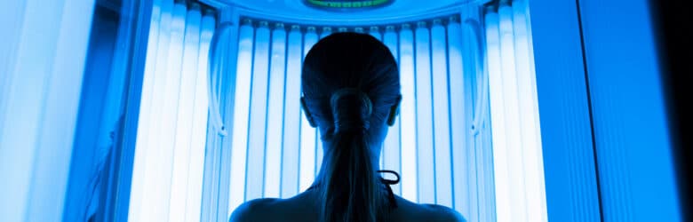 Woman approaching tanning bed